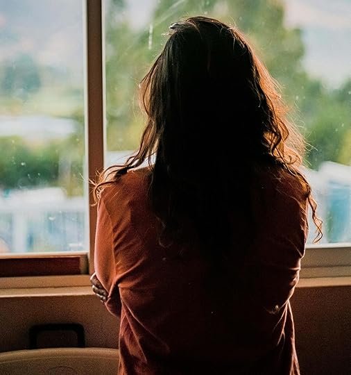 Sad woman looking out window. Learn to control your emotions and behaviors by overcoming your unhealthy patterns with the help of a DBT used in an adult intensive outpatient program in Houston, TX.