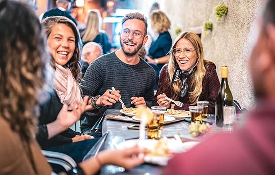 millennial group travel - people at dinner 