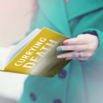 woman holding currying death book
