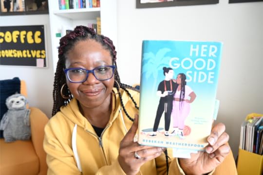 Shade holds copy of novel, Her Good Side.