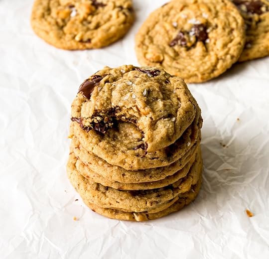A stack of cookies with gooey chunks of chocolate visible.