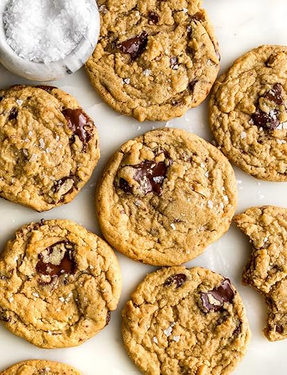 A bunch of cookies with chocolate chunks and sea salt flakes.