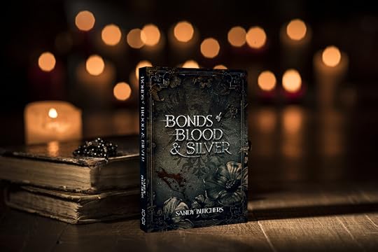 Antique precious Bible, Holy rosary in a pile on top of it so you cannot tell what the book or the rosary is, only get a sense of sacredness and age. The background is blurred and full of lit candles. The antique silver cover of Bonds of Blood and Silver is standing up in front of this, in a mockup paperback form.