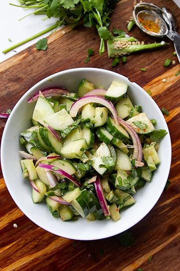 Asian cucumber salad finished in a white bowl.