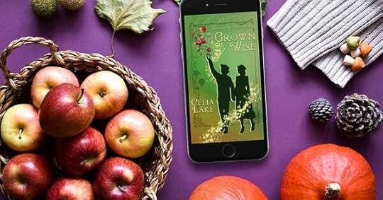 Grown Wise displayed on phone on a table with apples, squashes, fallen leaves, and other autumnal items.