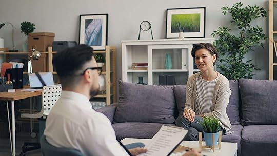 Woman sitting on a couch speaking as a male therapist sits across from her and listens. If you struggle with your emotions and are looking to heal from self harm, an adult intensive outpatient program in Houston, TX can help you begin to cope in healthy ways.