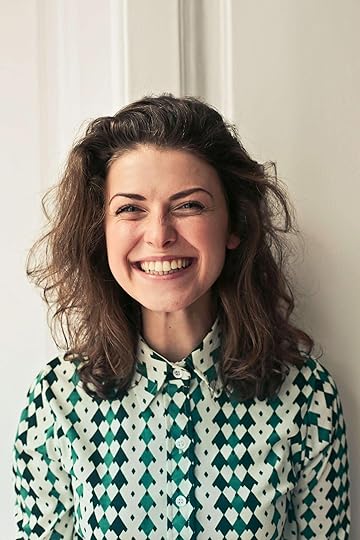 Image of a woman smiling in a patterned green shirt. Learn effective DBT skills in an adult intensive outpatient program in Houston, TX to help you manage and overcome your symptoms to help promote healing.