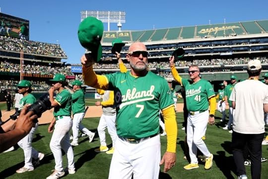 Oakland Athletics manager Mark Kotsay, center, and his team aknowledges fans after the A's played the last home game at the Coliseum in Oakland, Calif., on Thursday, Sept. 26, 2024. The Oakland Athletics won 3-2 against the Texas Rangers. The A's will move to Sacramento next season. (Ray Chavez/Bay Area News Group)