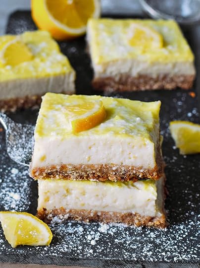 stack of 2 lemon cheesecake bars with lemon slices