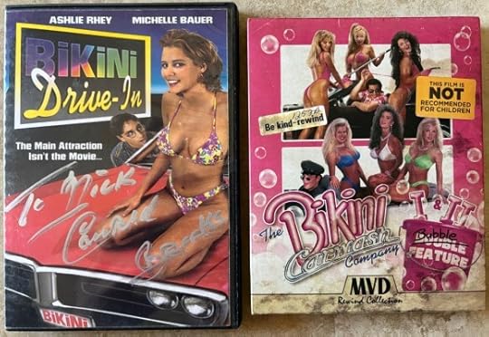 The Bikini Drive-In DVD (left side) is in a DVD case. It shows a woman in a purple yellow bikini sitting on the hood of a red car with a license plate that reads