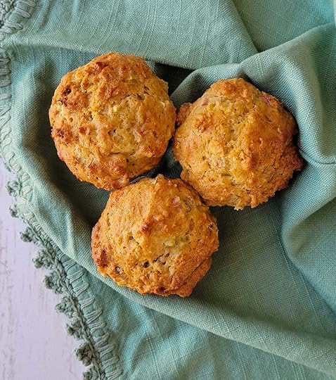 Close up of rhubarb muffins on a tea towel.