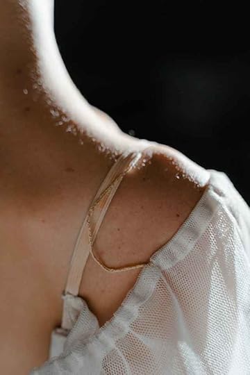 Current image: woman in white tank top