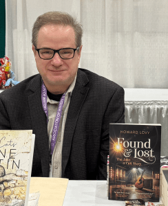 photo of Howard Lovy with his debut novel