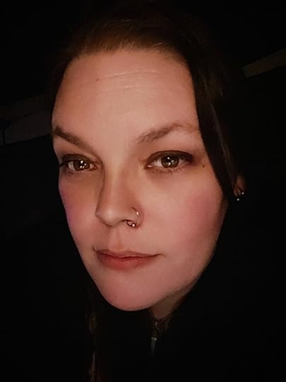 white author headshot, woman with dark hair and brown eyes.