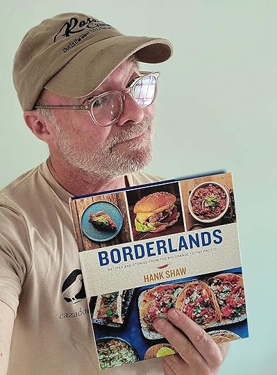 Hank Shaw holding a copy of his new book Borderlands.