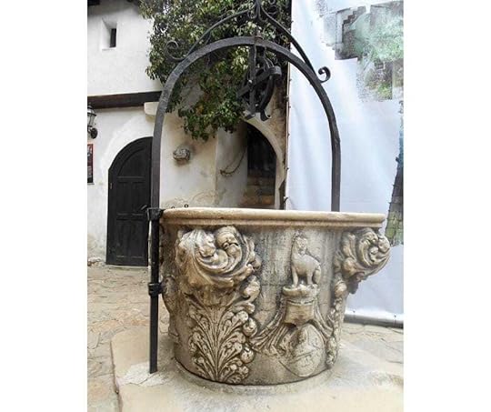 Inside Bran Castle courtyard there is a beautiful stone well