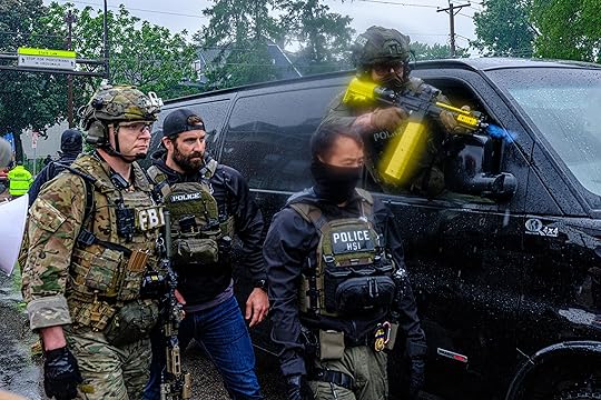 A Homeland Security Investigations (HSI) officer fires a chemical agent...