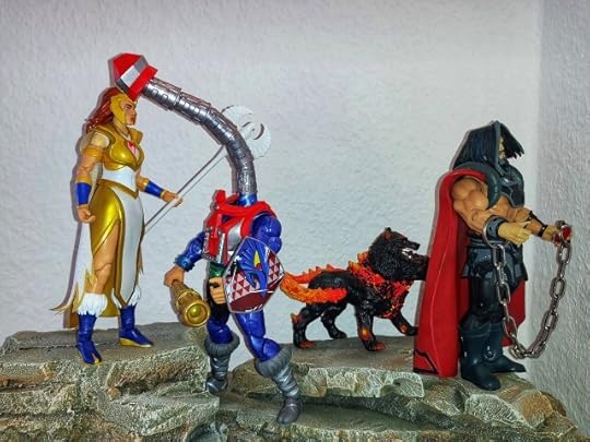 Mekaneck kisses Teela on the forehead, while Marzo is in chains.
