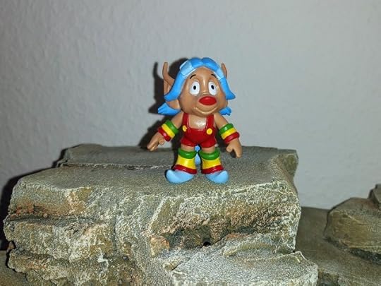 Loo-Kee stands on the clifftop to deliver the moral.