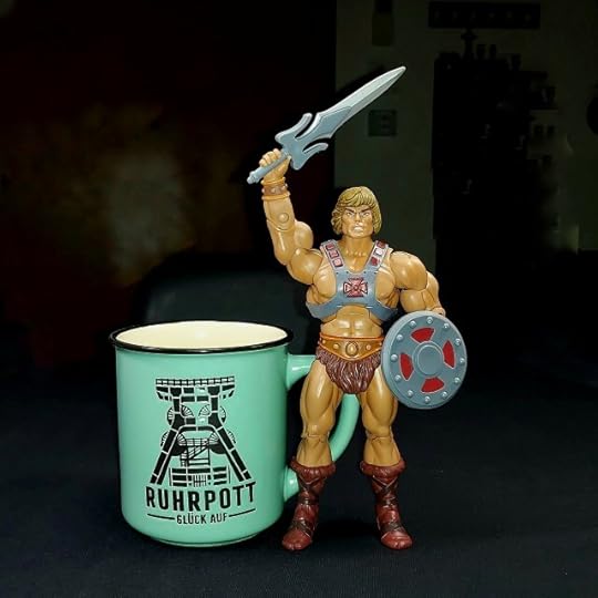 Masters of the Universe Classics He-Man posing with a Ruhrpott mug