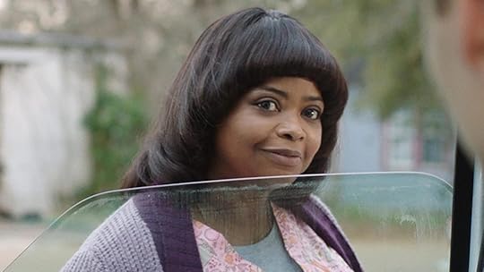 Octavia Spencer with an unflattering haircut looks into a ca window in Ma