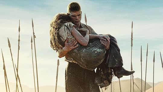 Rand carrying Moiraine in front of a field of spears in the key art for The Wheel of Time season three