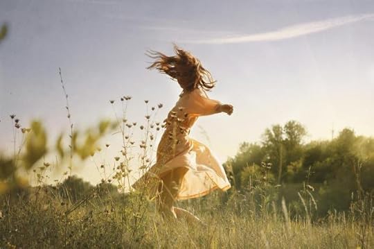 Current image: woman dancing in a field