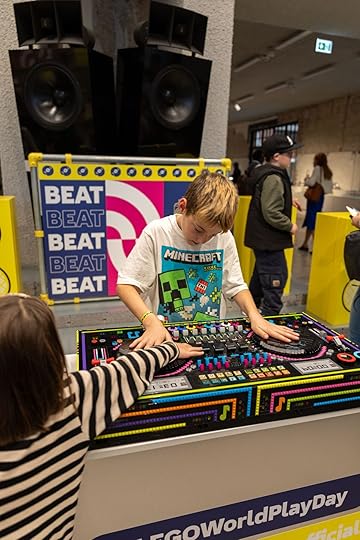 A kid in Berlin plays with a music playset for LEGO World Play Day
