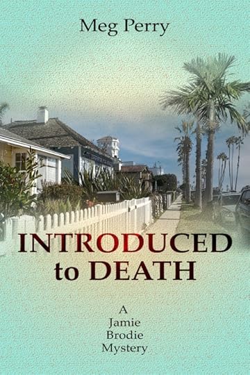 A street scene with one story houses and a white picket fence on the left and palm trees on the right, looking into the distance down the street