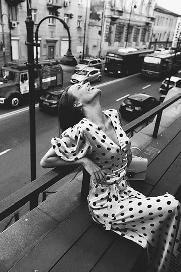 Current image: black and white photo of woman wearing polka dots dress