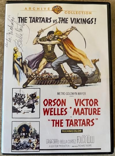 DVD of the film The Tartars. It depicts a viking in a sword fight with a tartar in front of a viking boat. In pen at the top left is is inscribed
