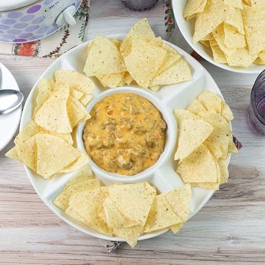 Dip bowl serving crock pot Velveeta Hamburger dip with chips.