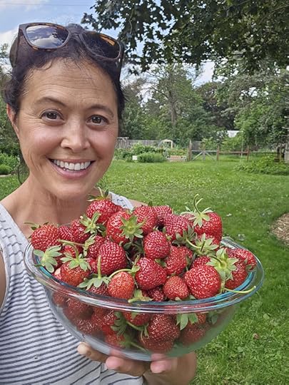 Author with a bowl of fresh picked strawberries