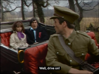 Zoe Heriot and Doctor Who in the back of a car, to the surprise of an officer, in Doctor Who and the War Games in Colour