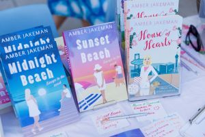 Covers of some of Amber Jakeman's feel-good fiction novels