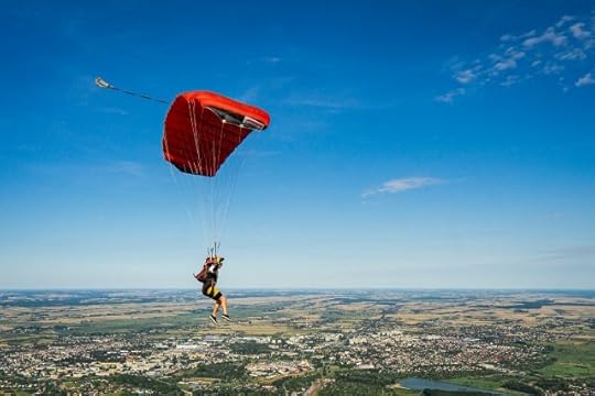 A skydiver gliding. Alive and breathing.
