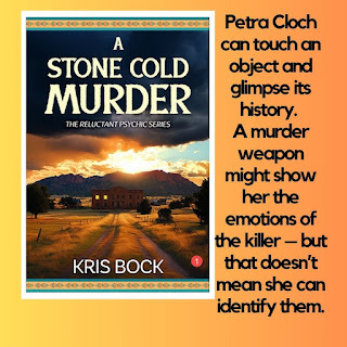 A book cover shows a dirt road with prairie grasses on either side. It leads toward a two-story building that looks ominous with only two windows lit up. Behind the building, the sun sets over a mountain. Dramatic clouds billow up, getting darker behind the book title: A Stone Cold Murder: The Reluctant Psychic Murder Mystery series by Kris Bock. Text to the right says: Petra Cloch can touch an object and glimpse its history. A murder weapon might show her the emotions of the killer – but that doesn’t mean she can identify them.