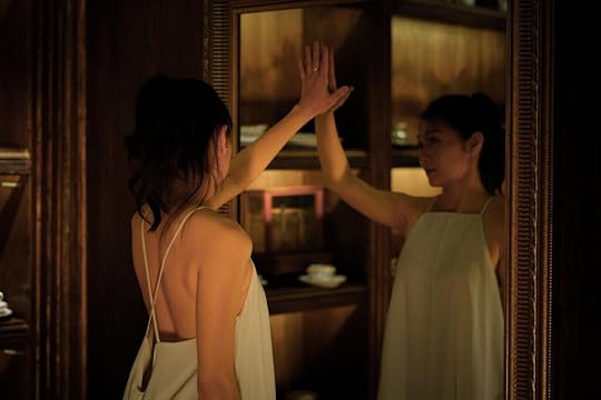 Sell by date - woman looking in mirror