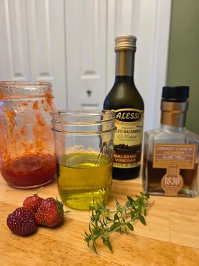 Ingredients to make strawberry vinaigrette, Strawberry jam, olive oil, balsamic vinegar and thyme.