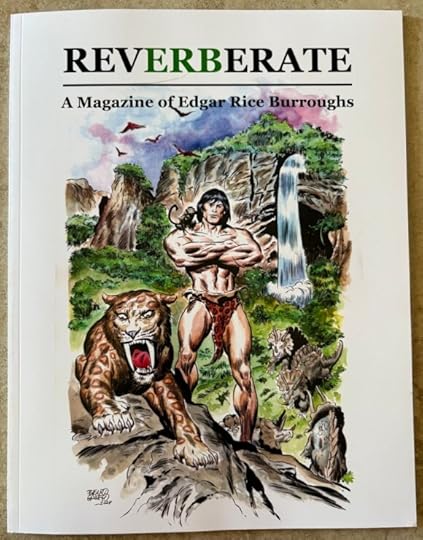 Copy of RevERBerate issue 1. The cover depicts Tarzan, with a monkey on his shoulder and a giant cat by his side. Behind him is a prehistoric valley of triceratops, lush vegetation, and a waterfall.