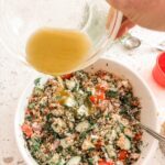 The dressing being poured into the No Cook Tabouli