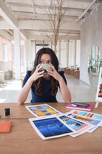 woman drinking coffee at desk