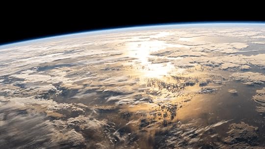 The sun's glint beams off a partly cloudy Atlantic OceanNASA ID: iss072e695136