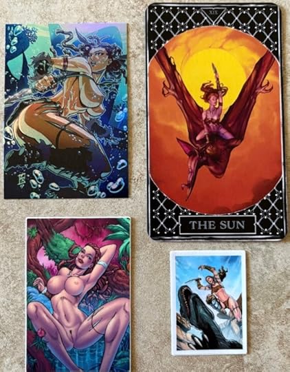 Four items here. First is a holo-foil trading card. It depicts Vanya under water with bubbles around her. Next is a large black Tarot card for The Sun. It shows Vanya atop of pterodactyl with a sword raised above her (very Heavy Metal). Next is a TINY sticker of Vanya leaping in the hair, lunging with knife in hand at a raptor. Finally there is a rectangular sticker of Vanya in the nude. She is nestled between the branches of a mossy tree with a purple sky behind her.