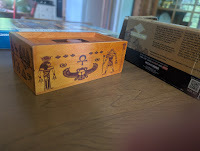 Wooden puzzle box on table, decorated with ancient Egyptian style drawings