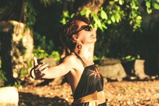 A woman facing up toward the sun, breathing. The best way to handle fear is to face it.