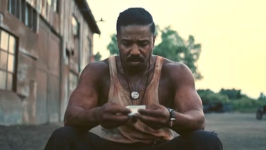 Michael B Jordan as Smoke in Sinners, a horror dad