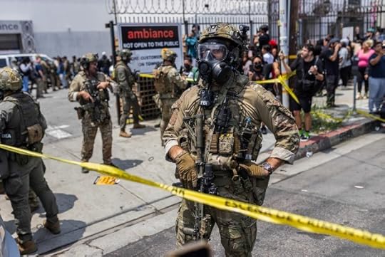 Federal immigration authorities face off against protesters during an ICE raid at Ambiance Apparel in Downtown Los Angeles on June 6, 2025. (J.W. Hendricks - CalMatters)