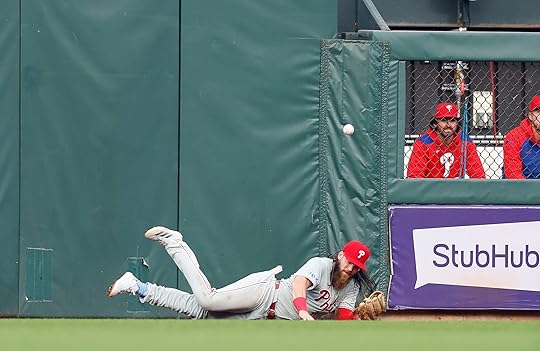 The ball bounces over the head of Philadelphia Phillies’ Brandon...