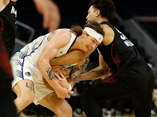 Golden State Warriors’ Gabe Madsen (55) fights for the ball...
